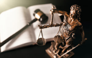 Lady justice. Statue of Justice in library. Legal and law background concept for help after neck pain after car accident